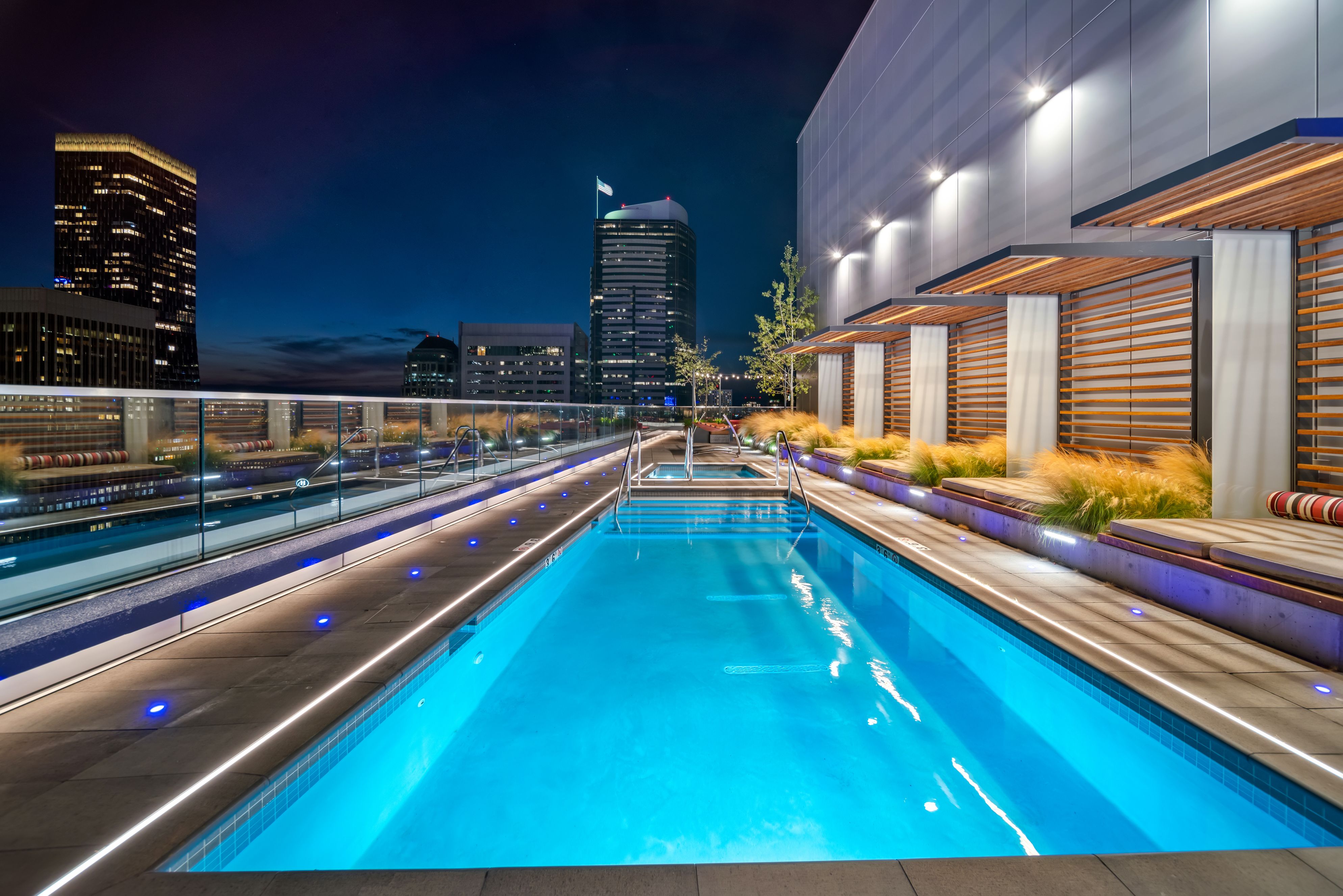 Luxury rooftop pool overlooking Seattle skyline at Ovation Apartments